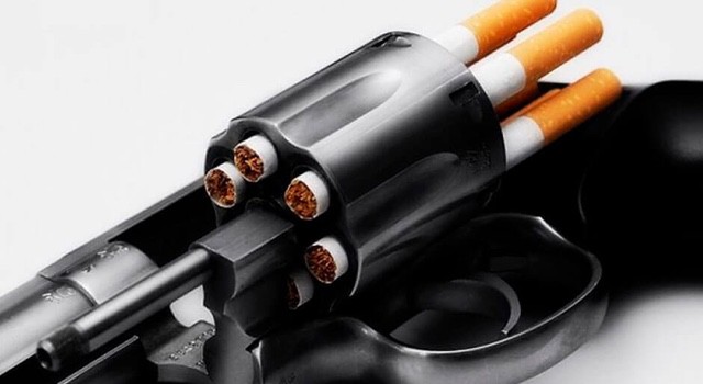 Close-up of cigarettes in a gun cylinder